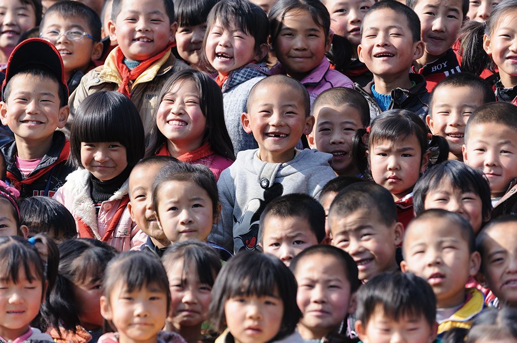 A group of smiling pupils from a rural primary school