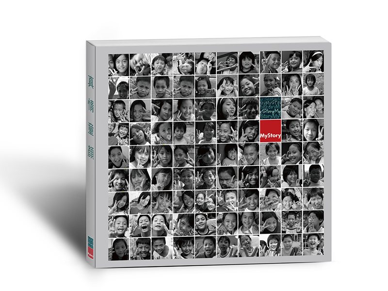 A Colour Way of Love commemorative book, its cover a grid of children’s portraits