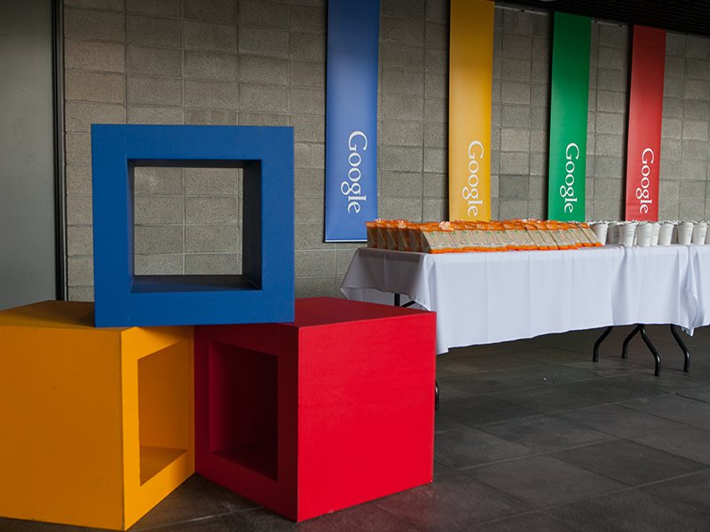 Colourful photo frames and props at a Google event venue