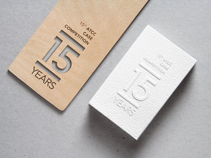 A wooden award plaque and embossed card for the 15th ATCC
